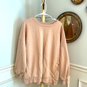 Peach sweatshirt with pockets
